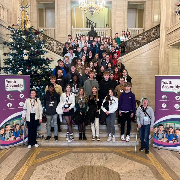 The new Youth Assembly pose on the steps in the Great Hall of Parliament Buildings before their first meeting.